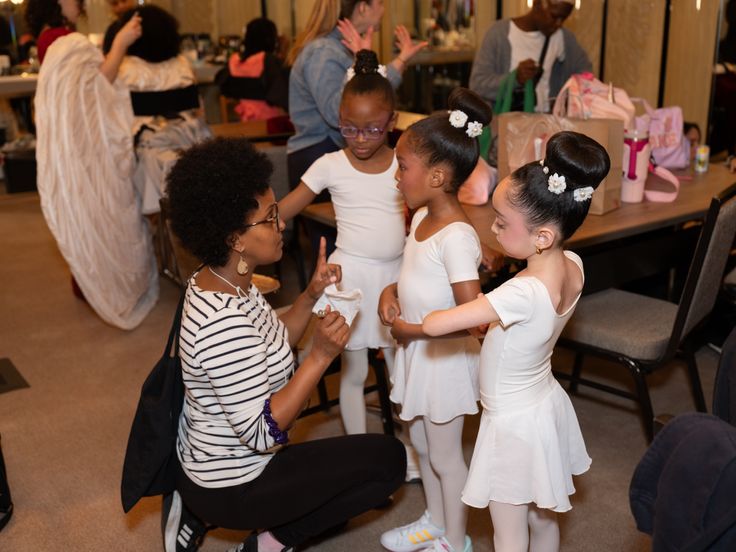 Sara helps students Nova'Jane, Raiyi and Zoe prepare for HSA's 60th Anniversary Gala held at Manhattan's Ziegfeld Ballroom in New York on Monday, May 20, 2024.