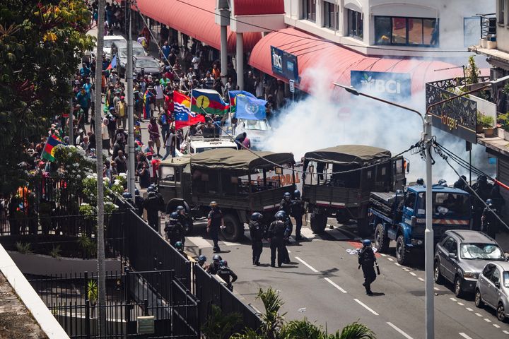 Protestors clash with French gendarmes and French Republican Security Corps police officers as they fired teargas during a demonstration against electoral reforms. 