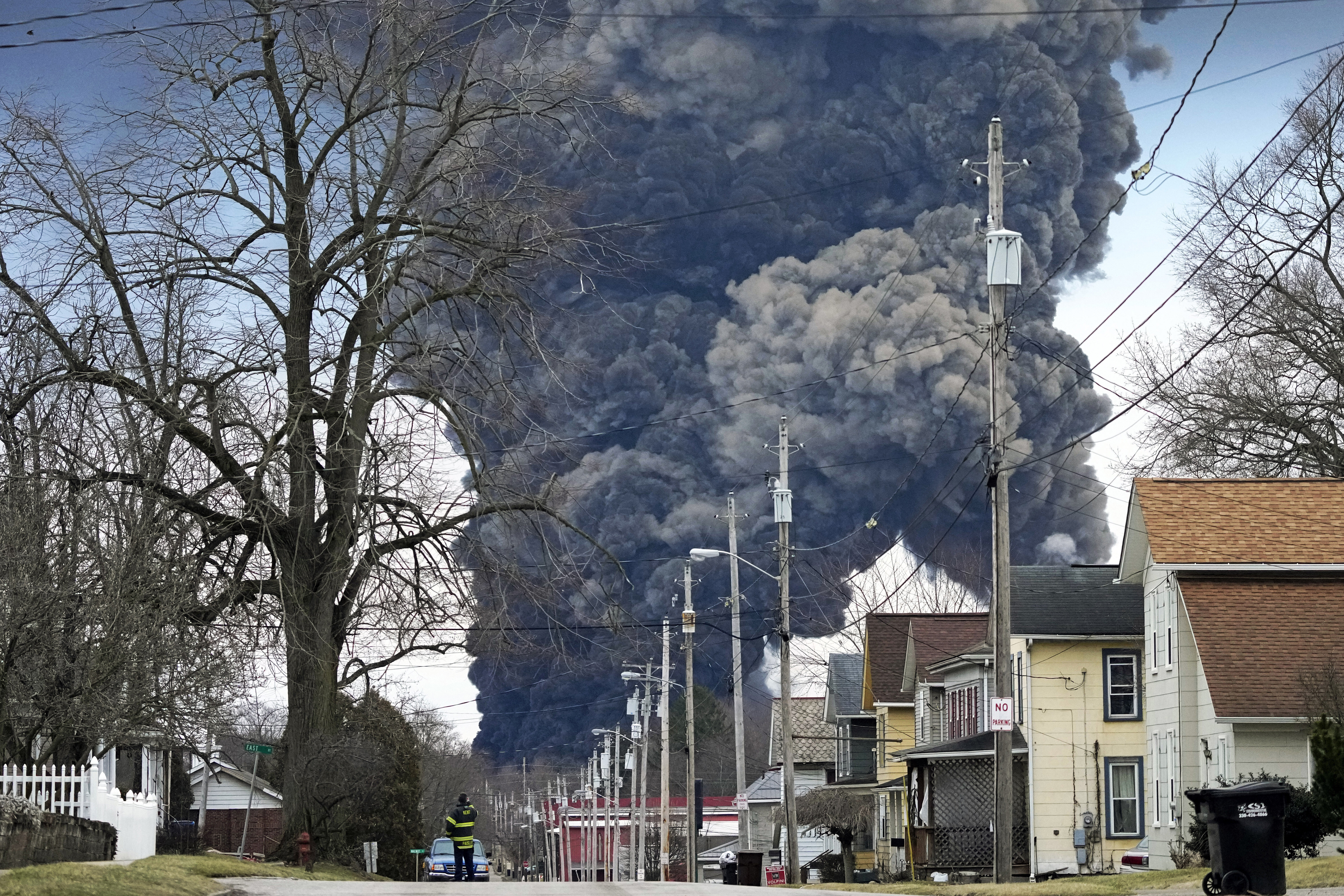 A black plume rises over East Palestine, Ohio, after responders set fire to rail tanker cars full of vinyl chloride on Feb. 6, 2023. 