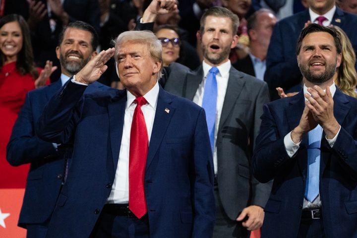 Former President Donald Trump, the Republican presidential nominee, is seen with his sons Donald Jr. and Eric and his running mate, Sen. JD Vance (R-Ohio), on the first day of the Republican National Convention in Milwaukee, July 15, 2024.