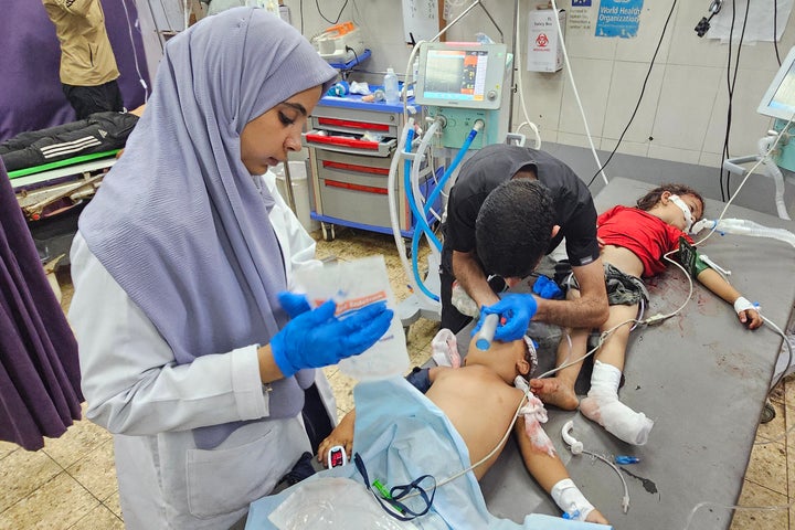 Palestinian health care workers treat children wounded in an Israeli strike near Khan Younis, at Nasser Hospital in Gaza, on July 8, 2025.